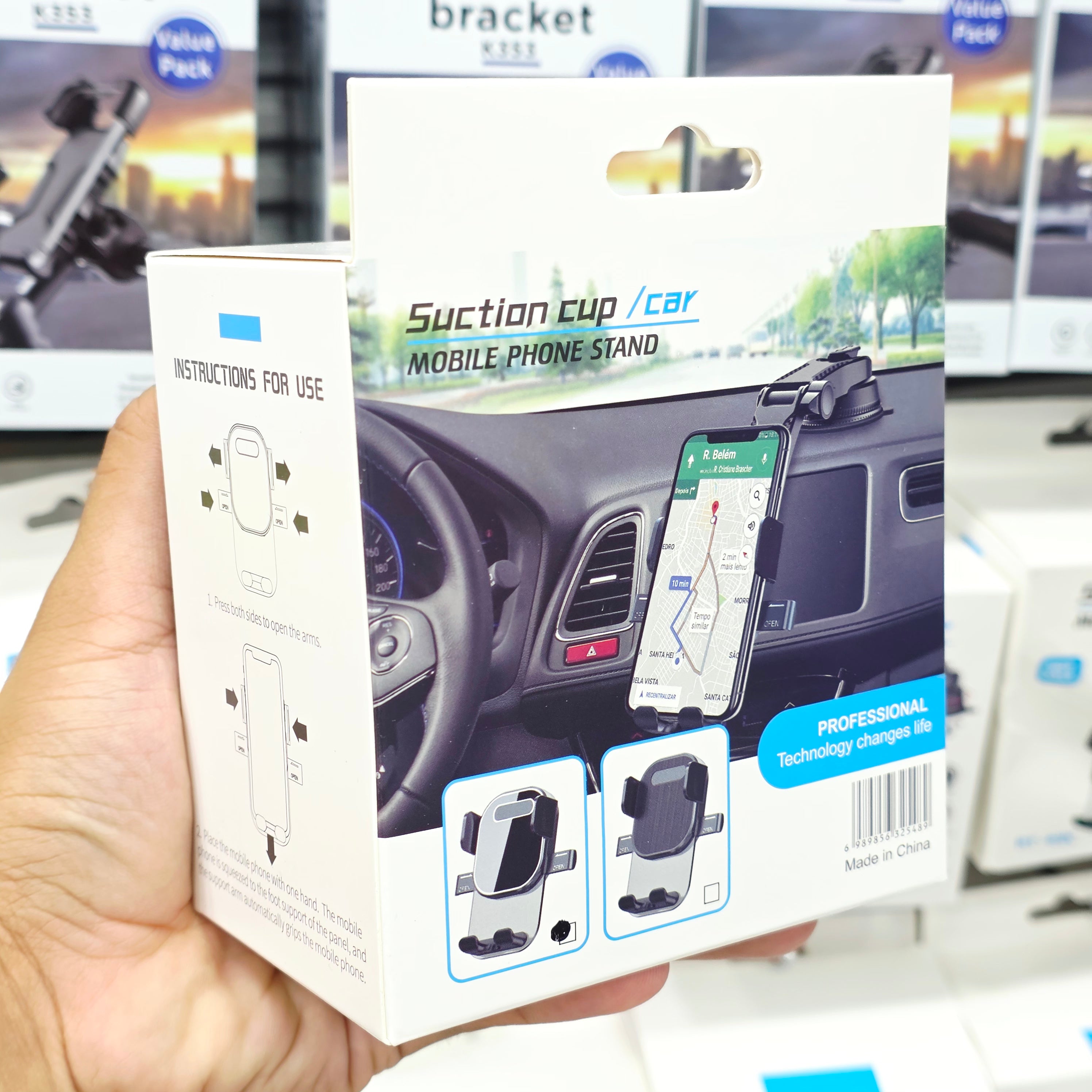 Vacuum 360 degree and height adjustable in-car phone holder placed in the dashboard